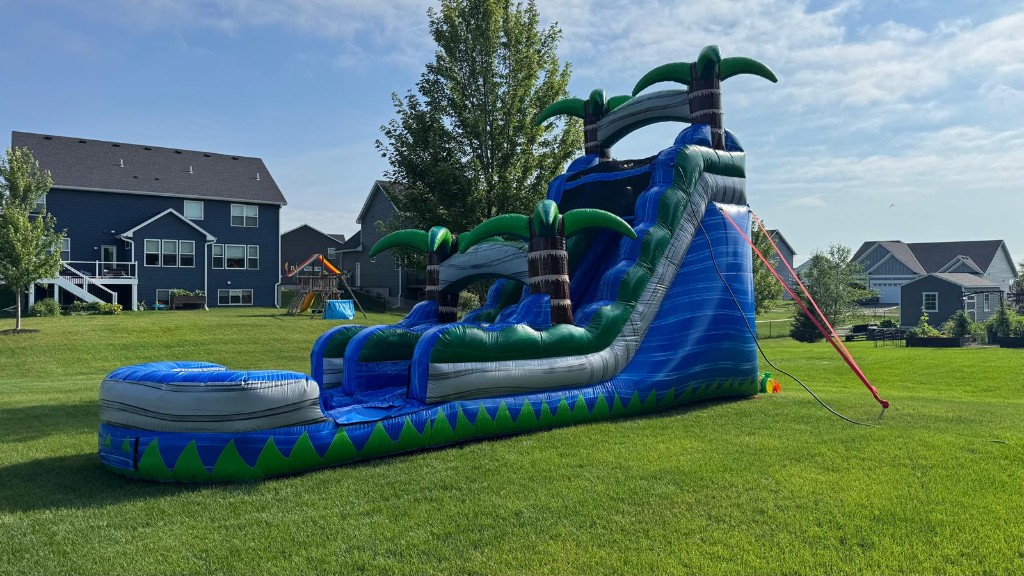 Blue Crush 18 foot water slide on a lawn