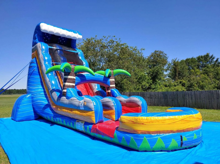 Tropical Fire Blast 18 foot water slide set up on a lawn